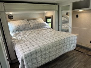 A master bedroom that deserves the name, there's a lot to love here. A king-size bed with a power base. A reversible soft/firm mattress. A walk-in closet. That's just getting started.